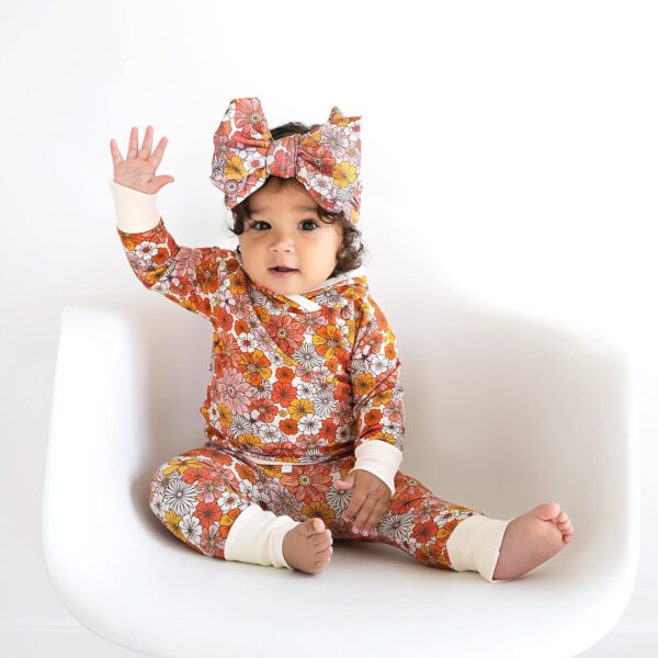 gigi and max louisa hoodie set Baby in floral outfit waving hand