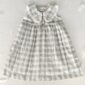 Plaid toddler dress with lace collar and buttons.