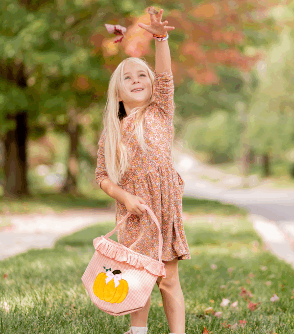 bits & bows halloween ruffled pumpkin tote Girl tossing leaves in autumn park