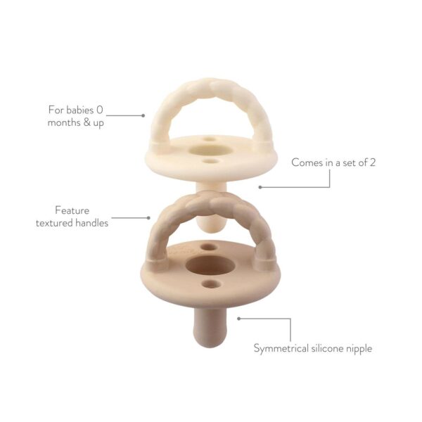 itzy ritzy sweetie soother™ silicone pacifier set of 3 coffee & cream: coffee & cream Cream pacifiers with textured handles and silicone nipples.