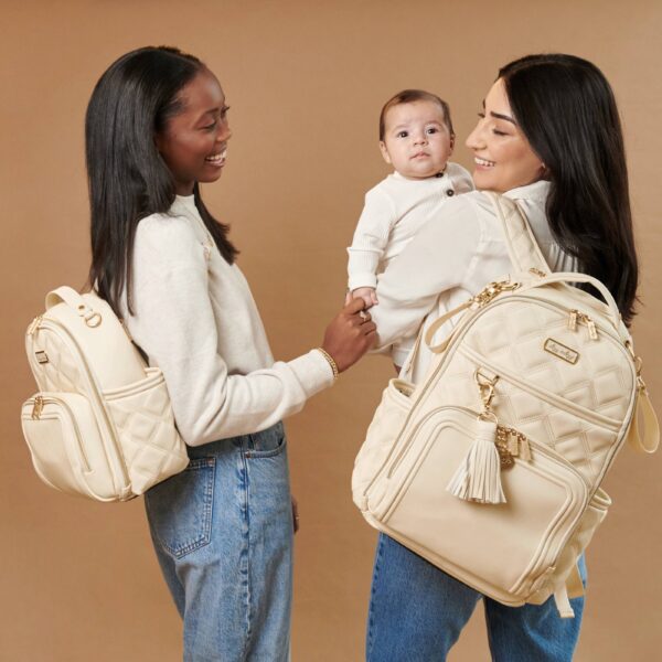 itzy ritzy milk & honey itzy mini plus™ diaper bag backpack Women with stylish quilted backpacks and baby.