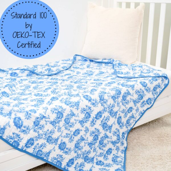 lollybanks a peony for your thoughts baby toddler muslin quilt Blue floral blanket on crib with OEKO-TEX certification.