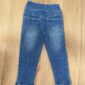 Back view of blue children's jeans.