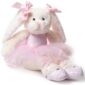 Stuffed bunny wearing pink tutu and ballet shoes.