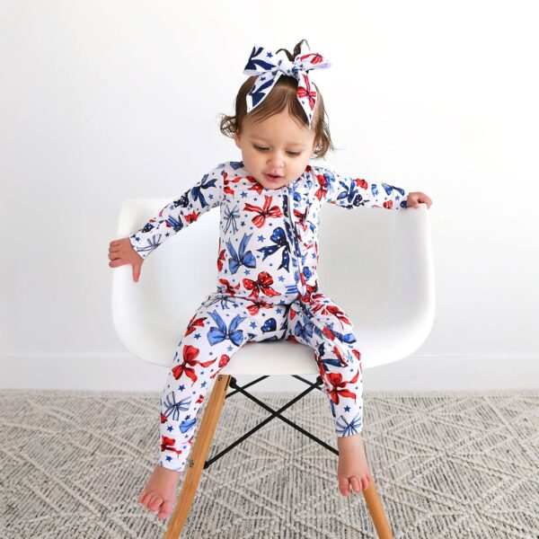 gigi and max eleanor bow clip bow 4th of july hair accessory Toddler wearing patriotic star and butterfly outfit.