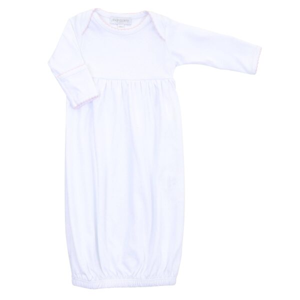 White infant gown with long sleeves and elastic hem.